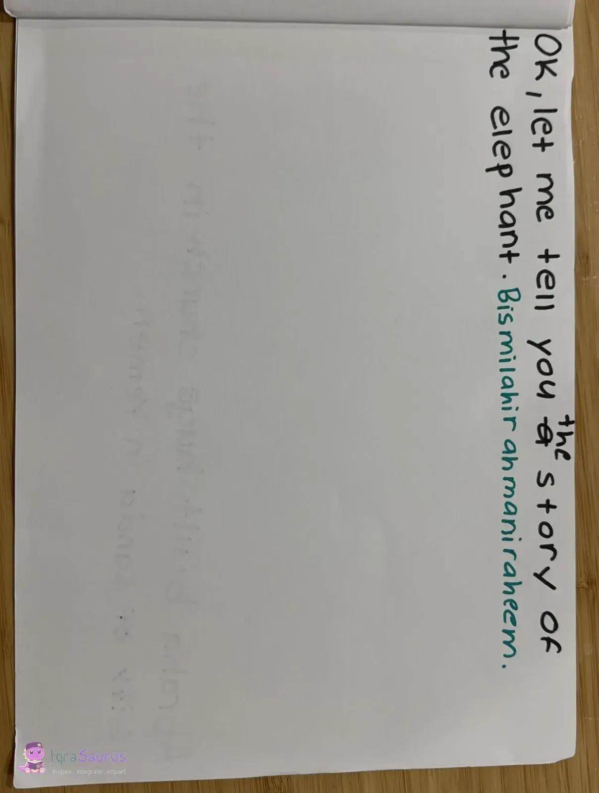 A mostly blank page with one line of black writing and a line in green at the top, left for a picture.