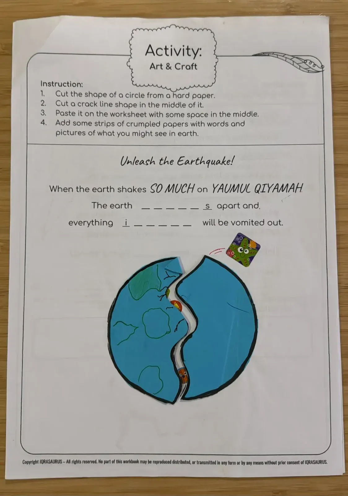 An Art & Craft page: a paper globe split down the middle by a crack